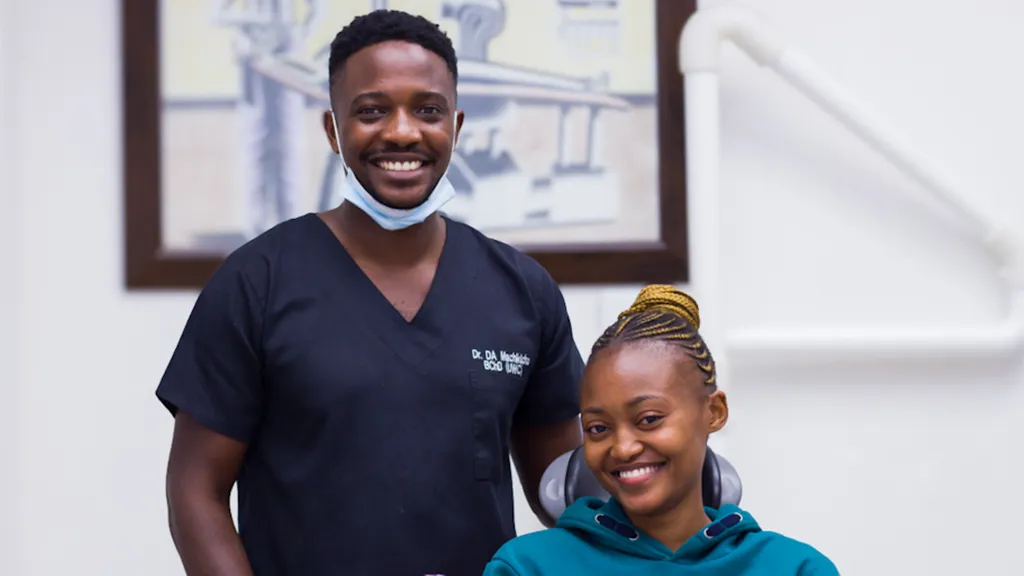 Dr Daniel With a patient smiling