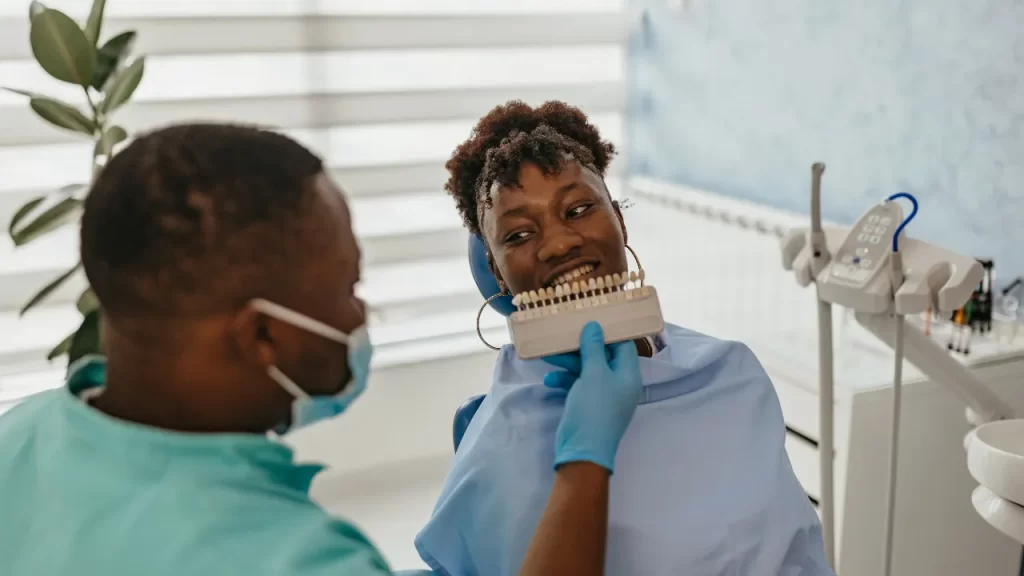 Woman doing veneers sampling at the dentist